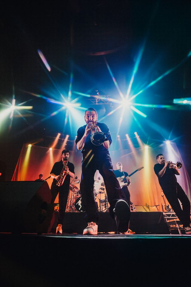 Brass section performing on stage